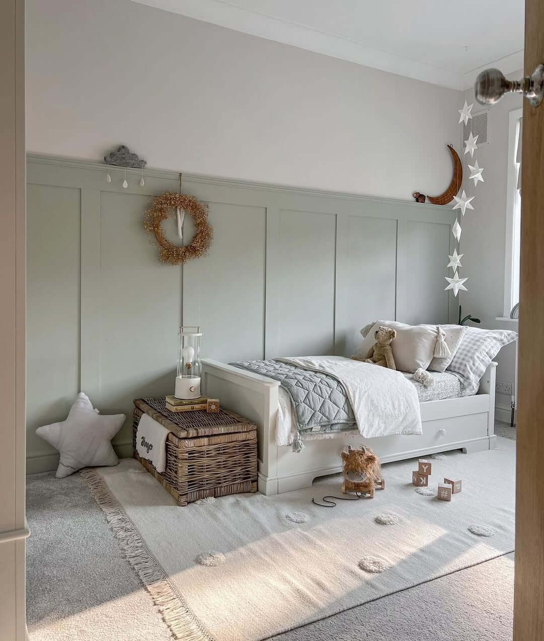 Paneling Creates a Cozy Backdrop for a Sweet Nursery