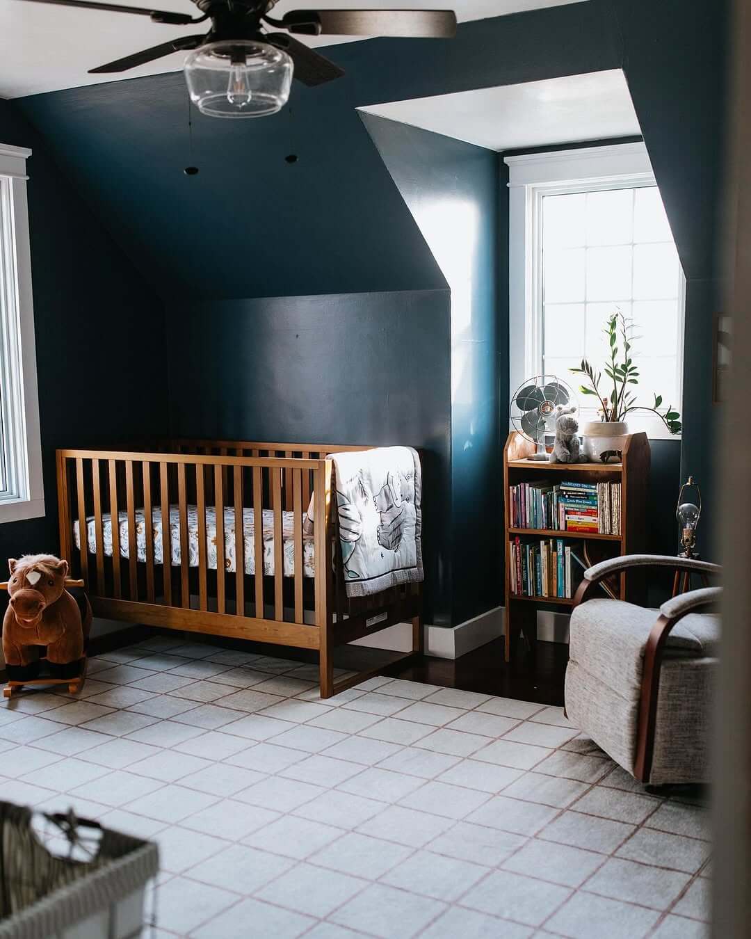 Choose Deep Navy Walls for a Cozy, Dramatic Nursery