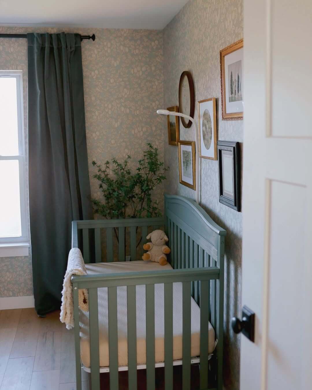 Gallery Wall of Mixed Frames Adds Personal Touch Above Crib