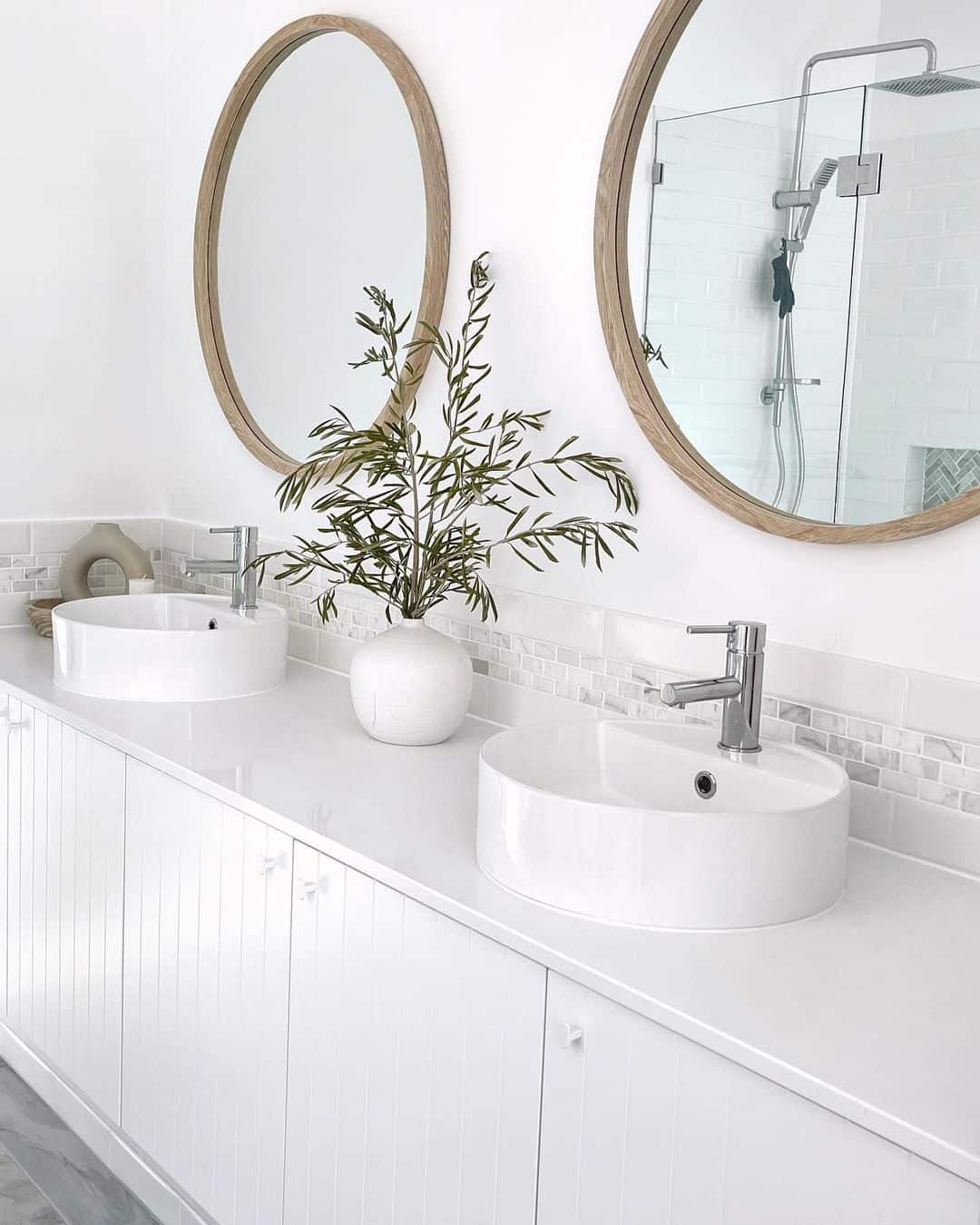 Round Mirrors With Natural Wood Frames Add Warmth
