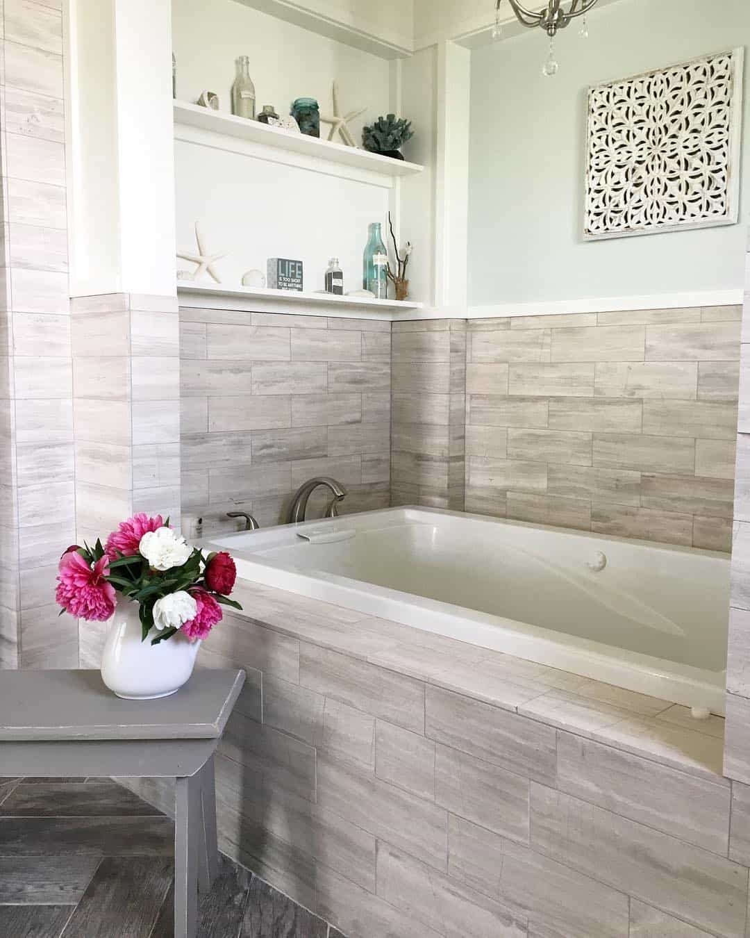 Open Shelving Displays Beach Finds Above the Tub