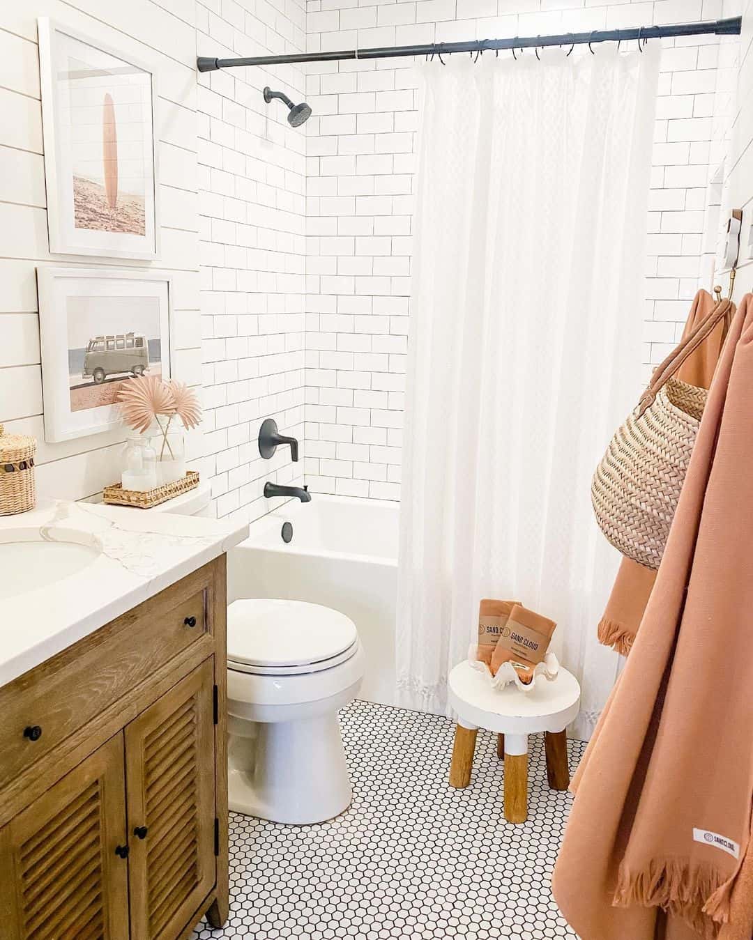 Stacked Artwork Adds Coastal Scenes Above the Vanity
