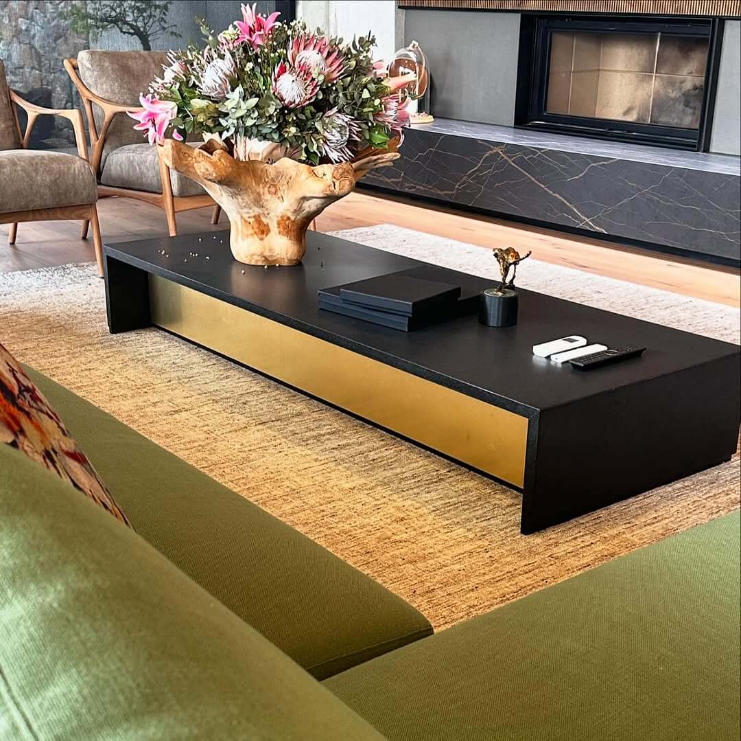 Glamorous Gold Inlay Accents a Black Coffee Table