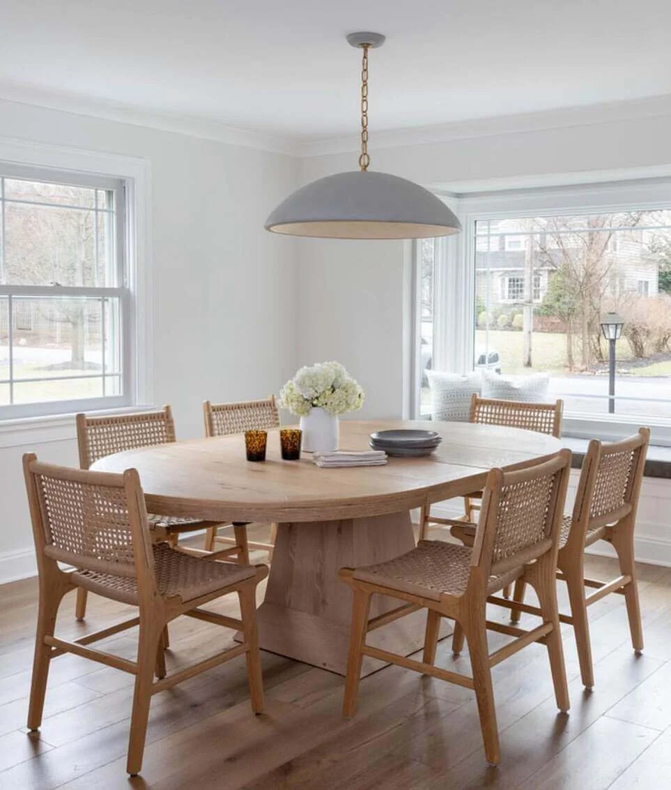 Oval Dining Table with White Hydrangeas and Amber Glass Holders