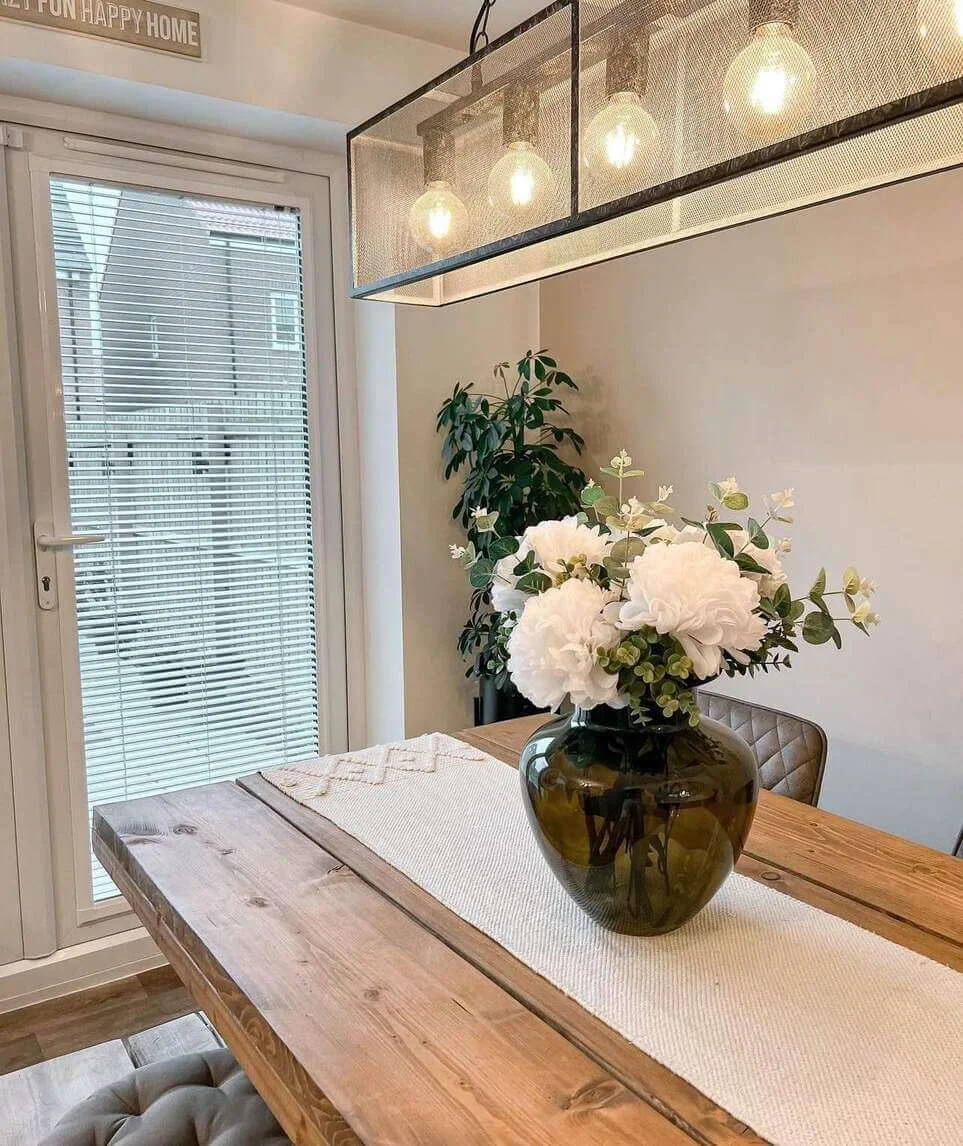 Olive Glass Vase Grounds a White Peony Bouquet