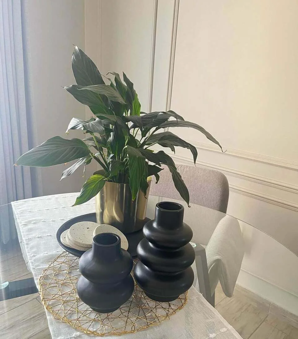 Stacked Black Vases Add Sculptural Interest to Table
