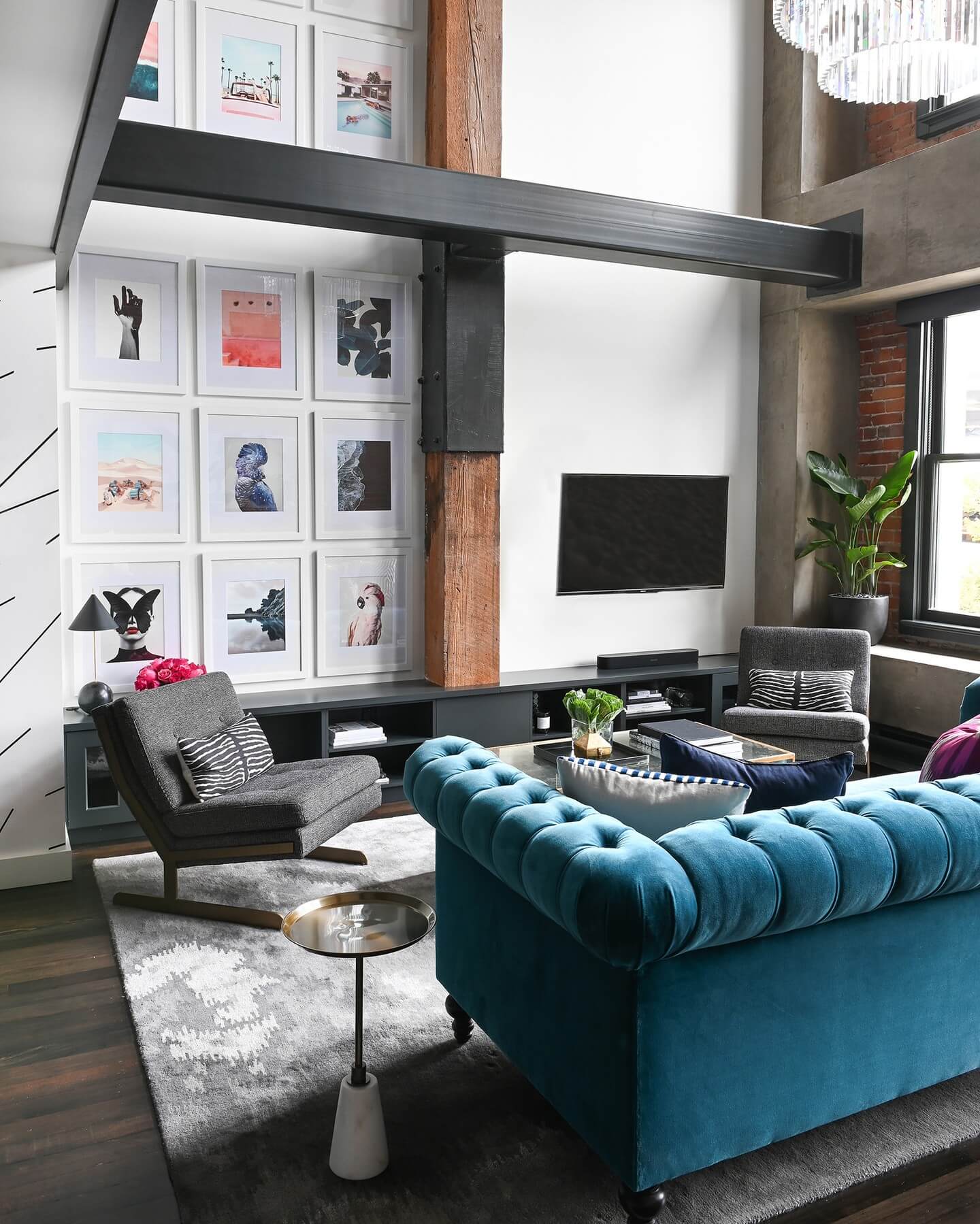 Gallery wall layering diverse prints and photos in white frames