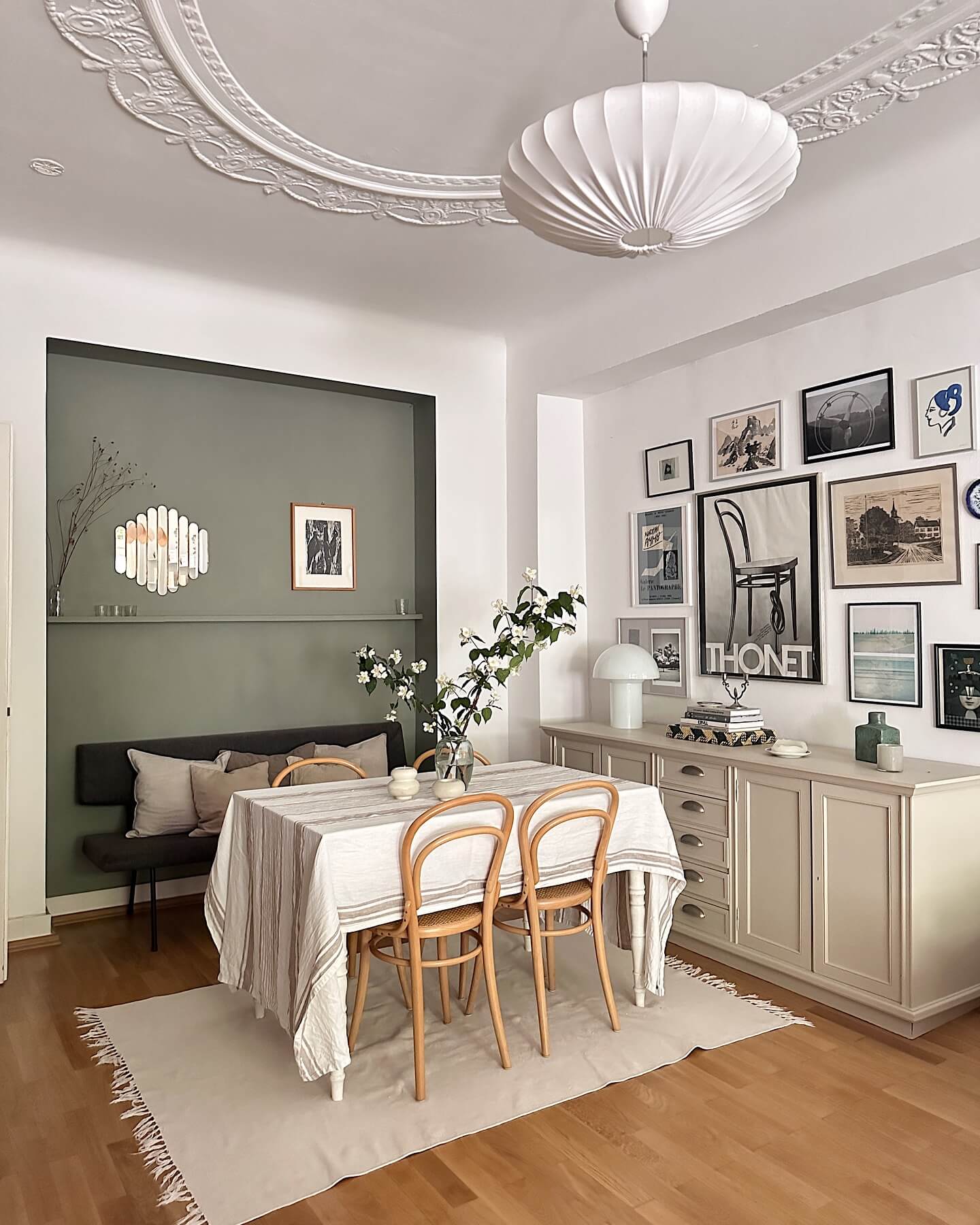 Mix Vintage Posters and Architectural Prints Above a Credenza