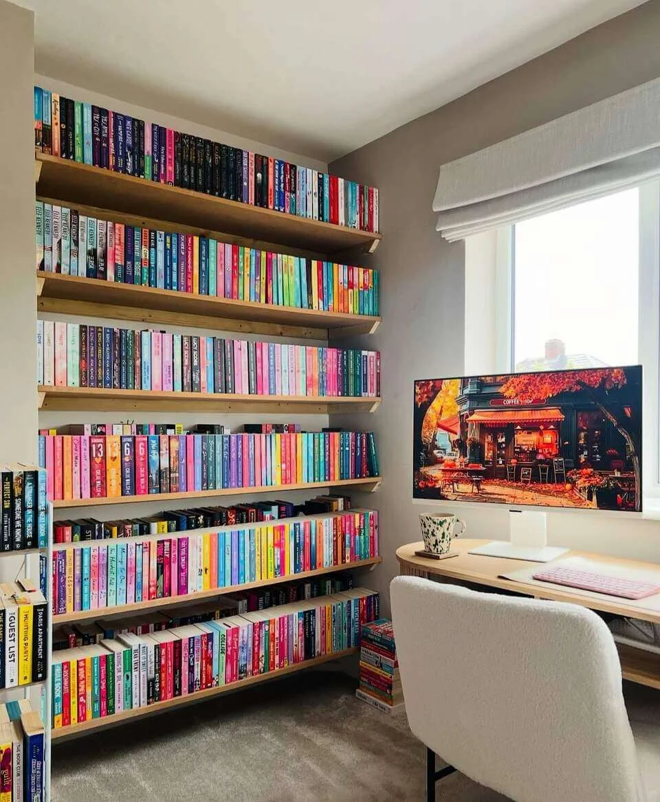 Wall of Bookshelves Creates a Vibrant Reading Hub