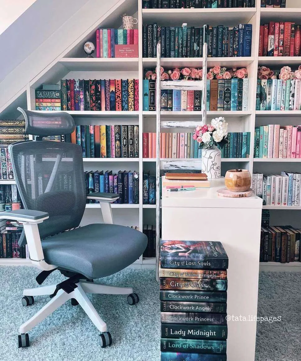 Decorative Roses Add Softness to White Bookshelves