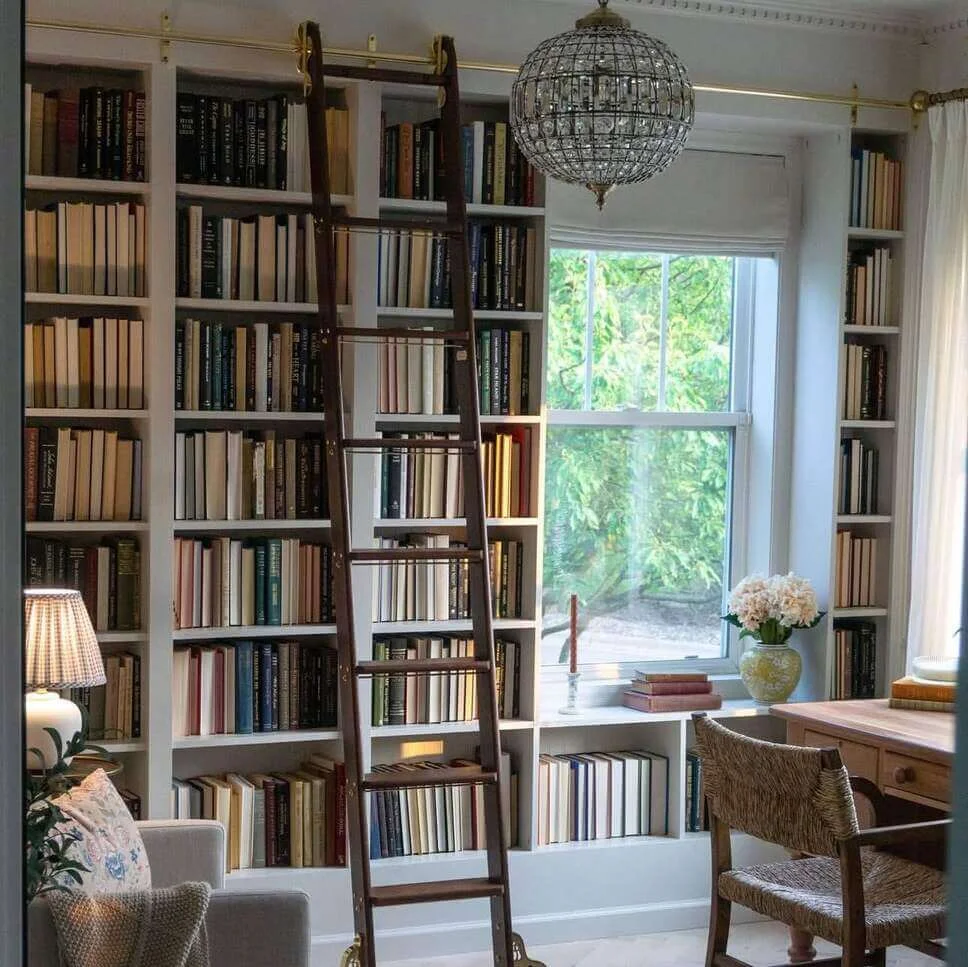 Sliding Library Ladder Accesses Books on Tall Shelves