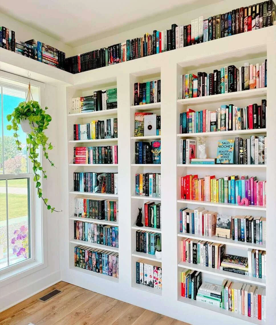 Line an Entire Wall With White Built-In Shelving