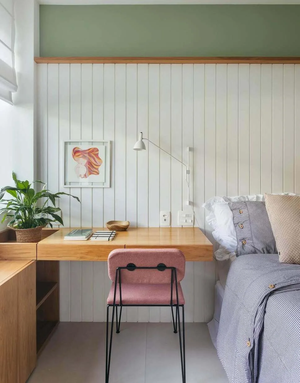 Wall-mounted desk with integrated drawers creates a streamlined workspace