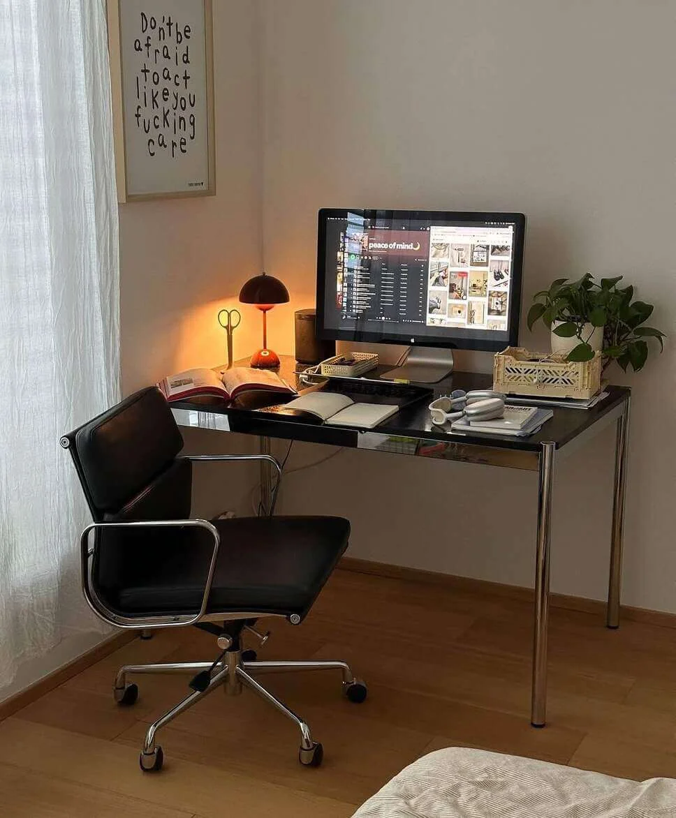 Desk lamp with a warm glow creates a cozy corner