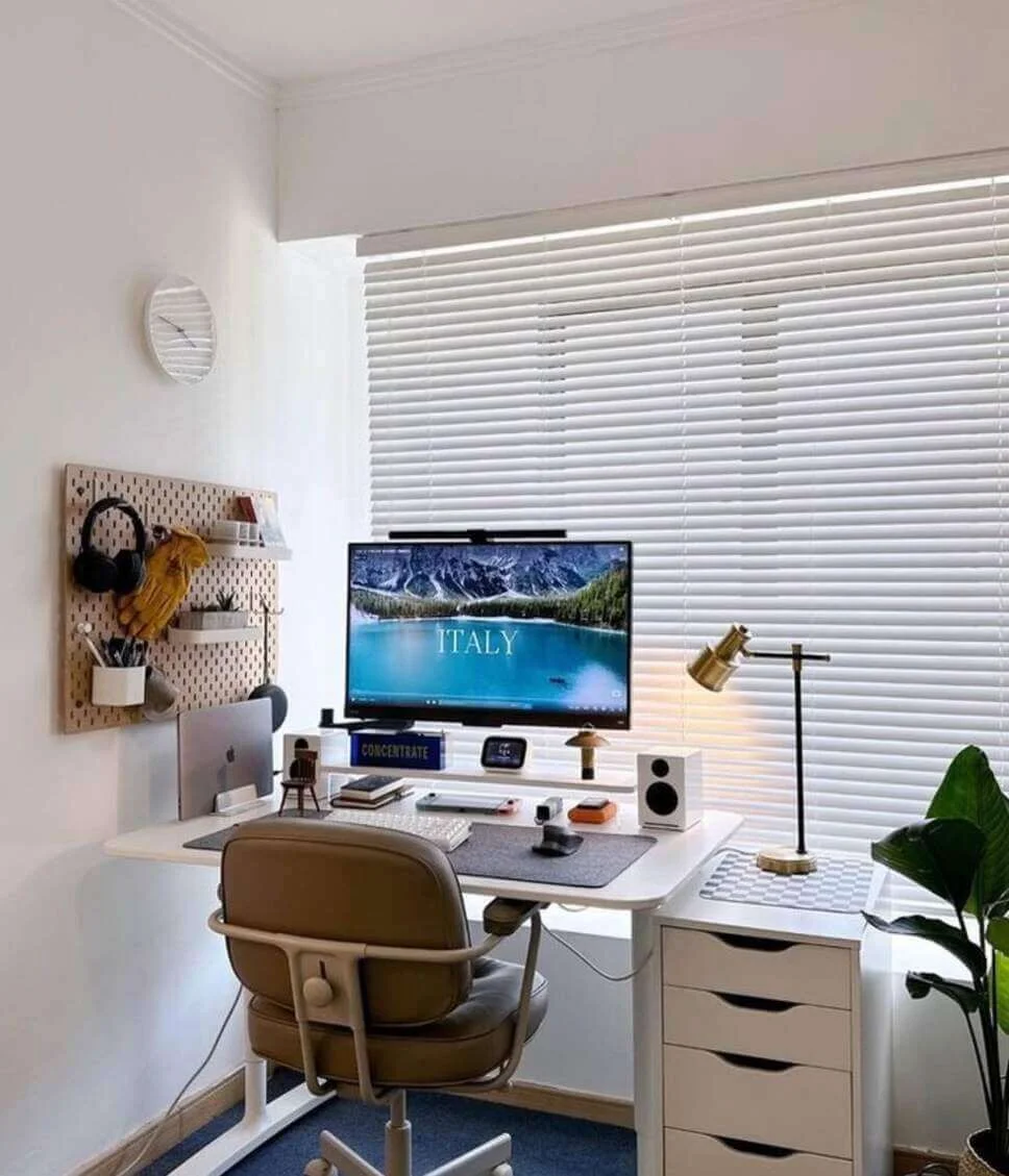 Pegboard Wall Organizes Desk Accessories and Headphones