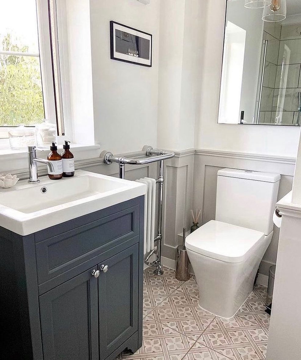 Classic Silver Knobs Enhance a Dark Grey Vanity
