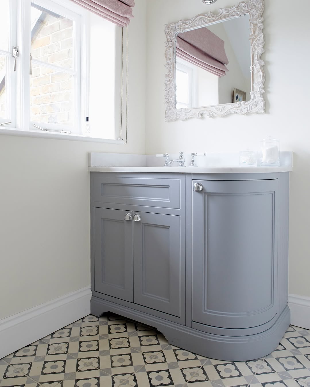 Soften Bathroom Corners with a Curved Grey Vanity