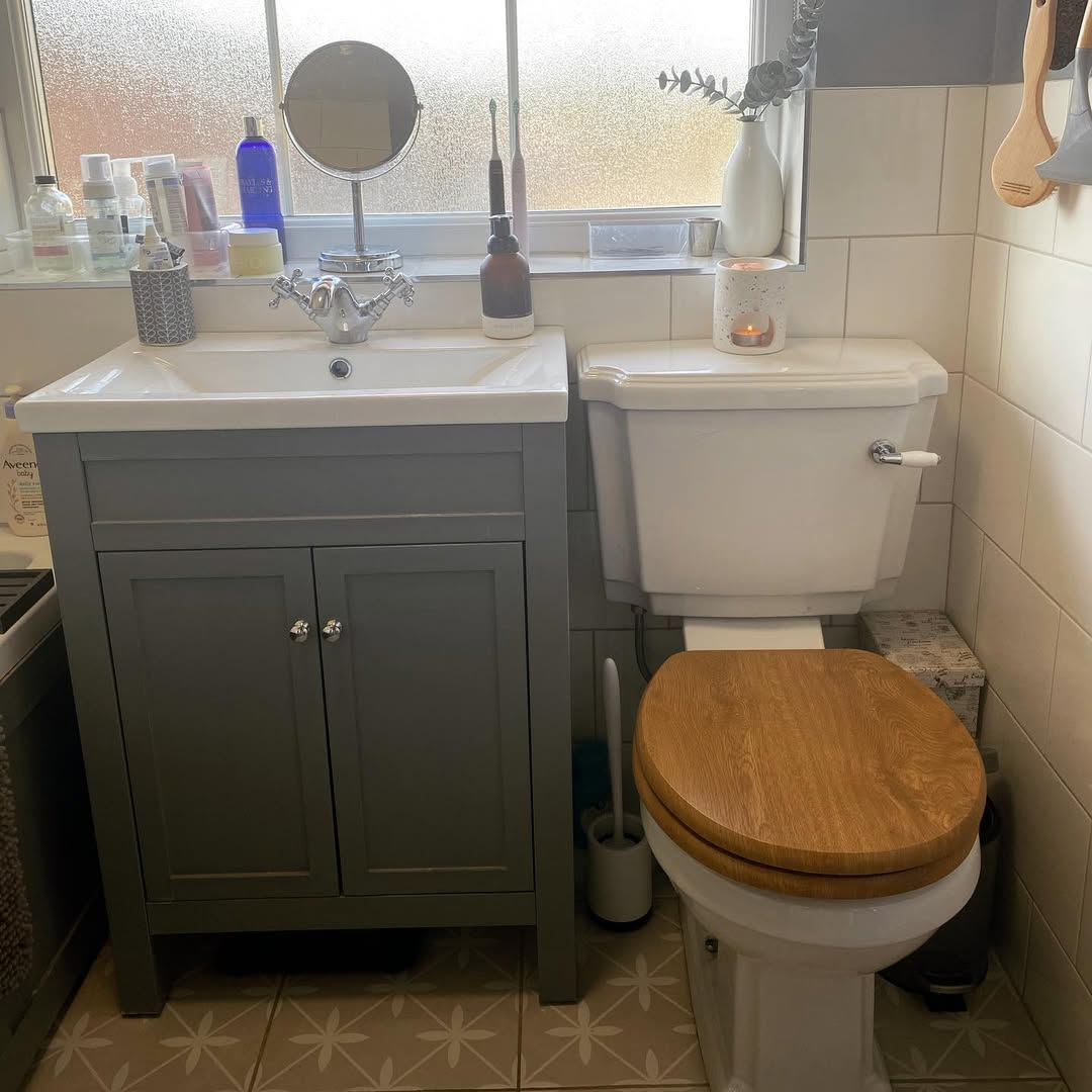Classic Storage with a Grey Vanity's Dual Doors and Silver Knobs