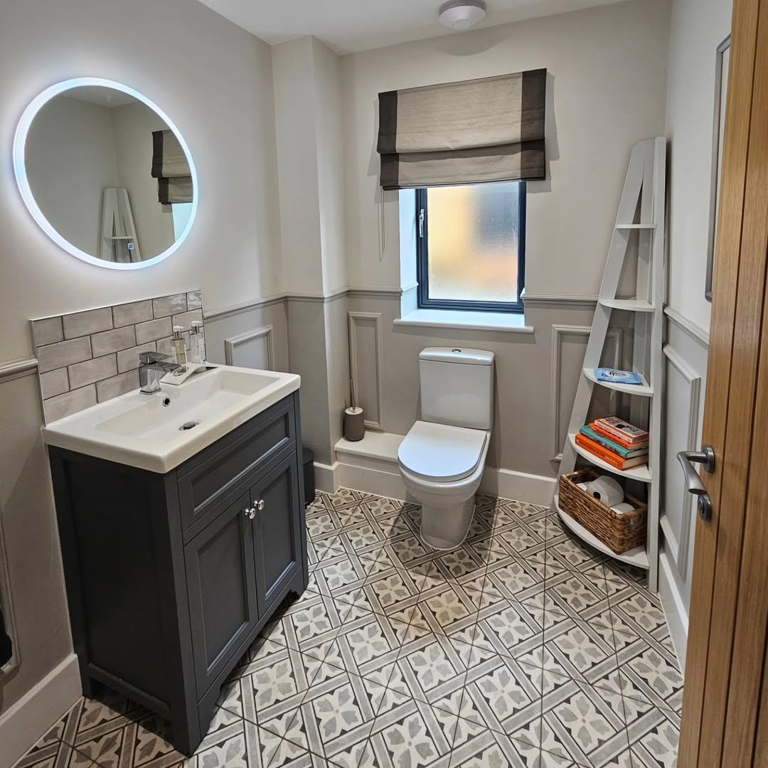 Utilize Vertical Space with a Ladder Shelf Next to the Toilet