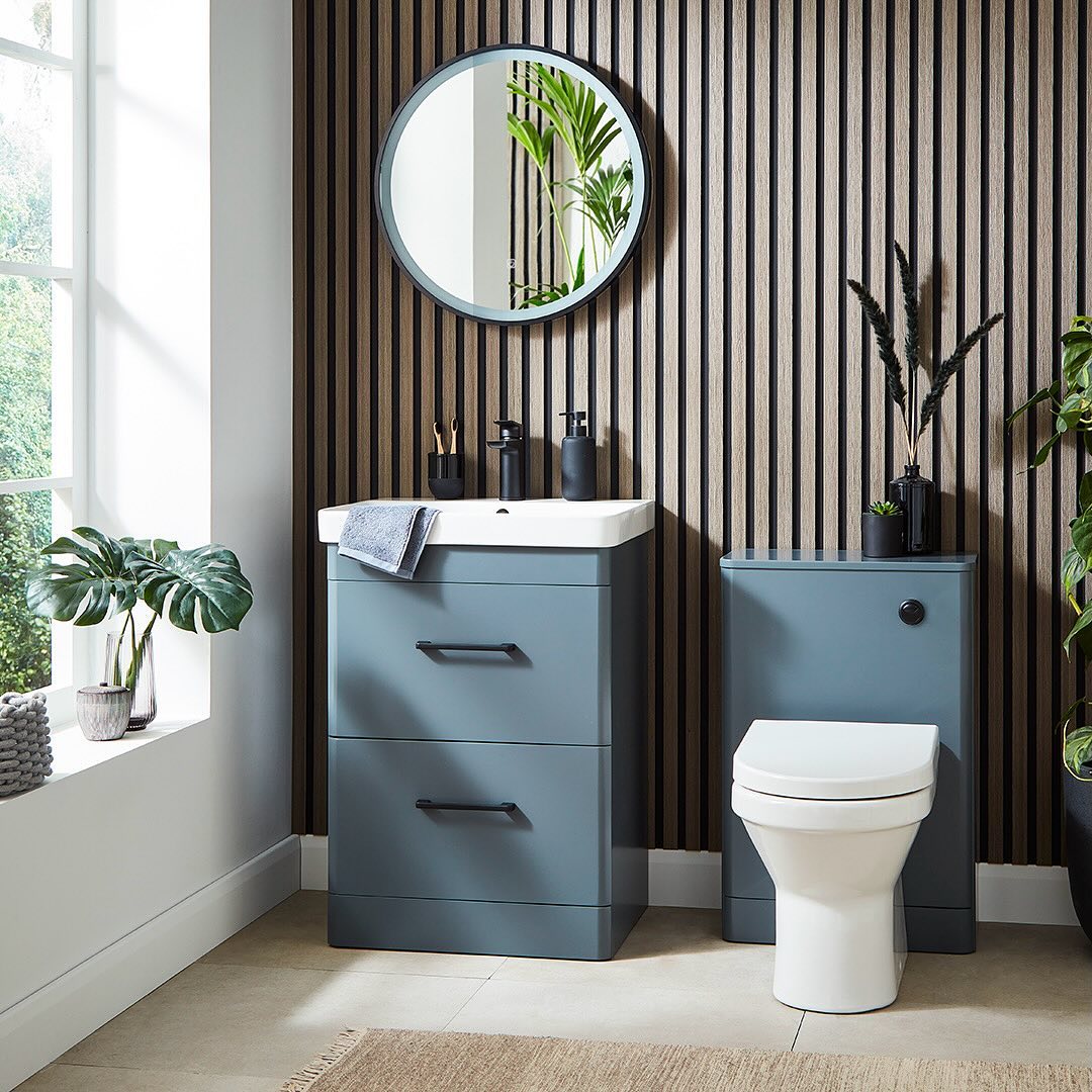Streamline Your Look with a Slate Blue Vanity and Black Pulls