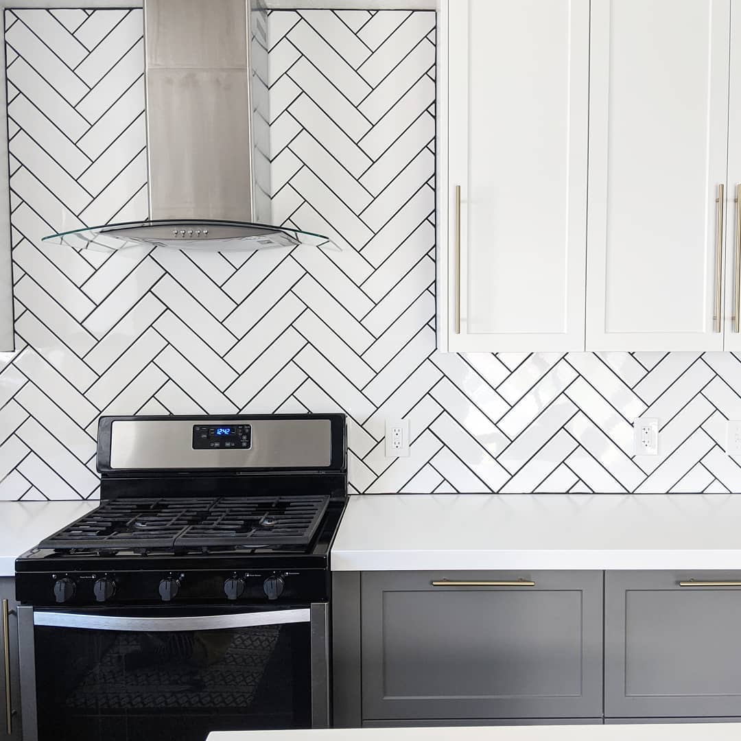 Bold Black Grout Makes White Subway Tile Pop in Herringbone