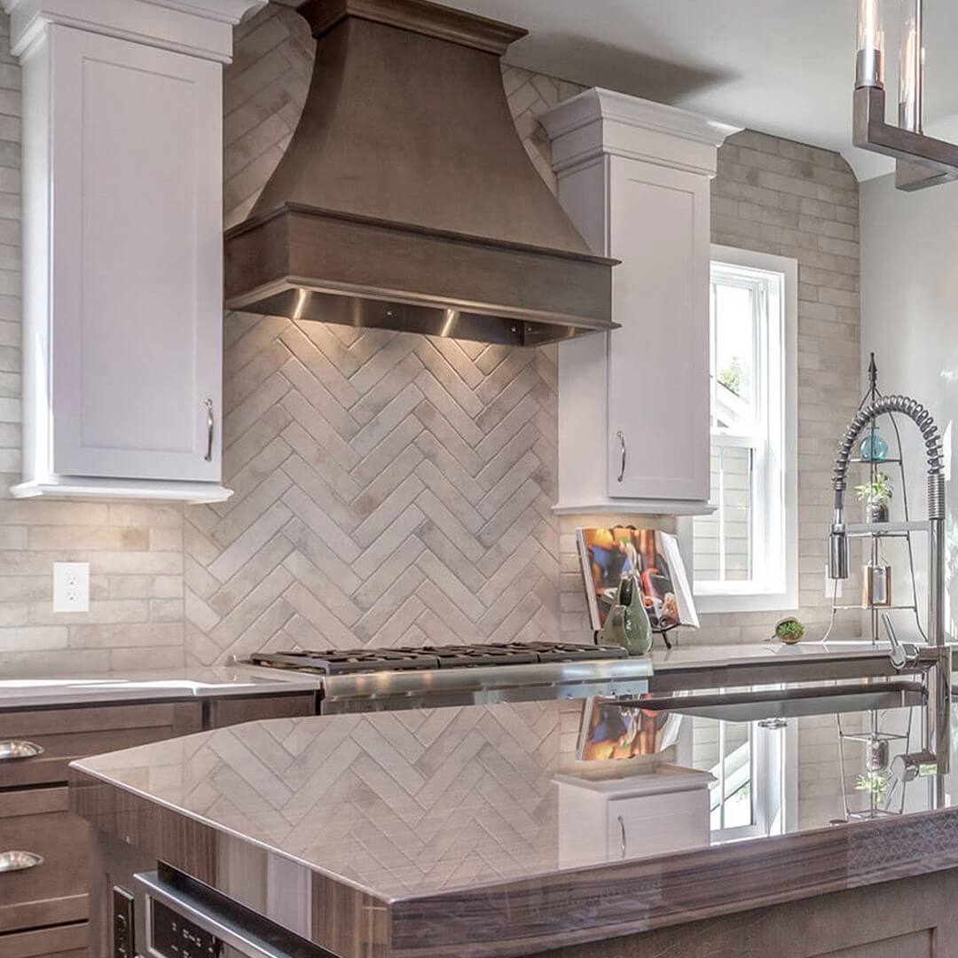 Subtle Stone Herringbone Backsplash Adds Natural Texture