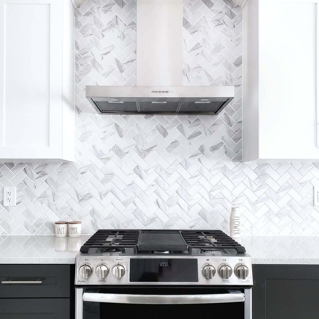 Marble Herringbone for Subtle Movement Above Stove