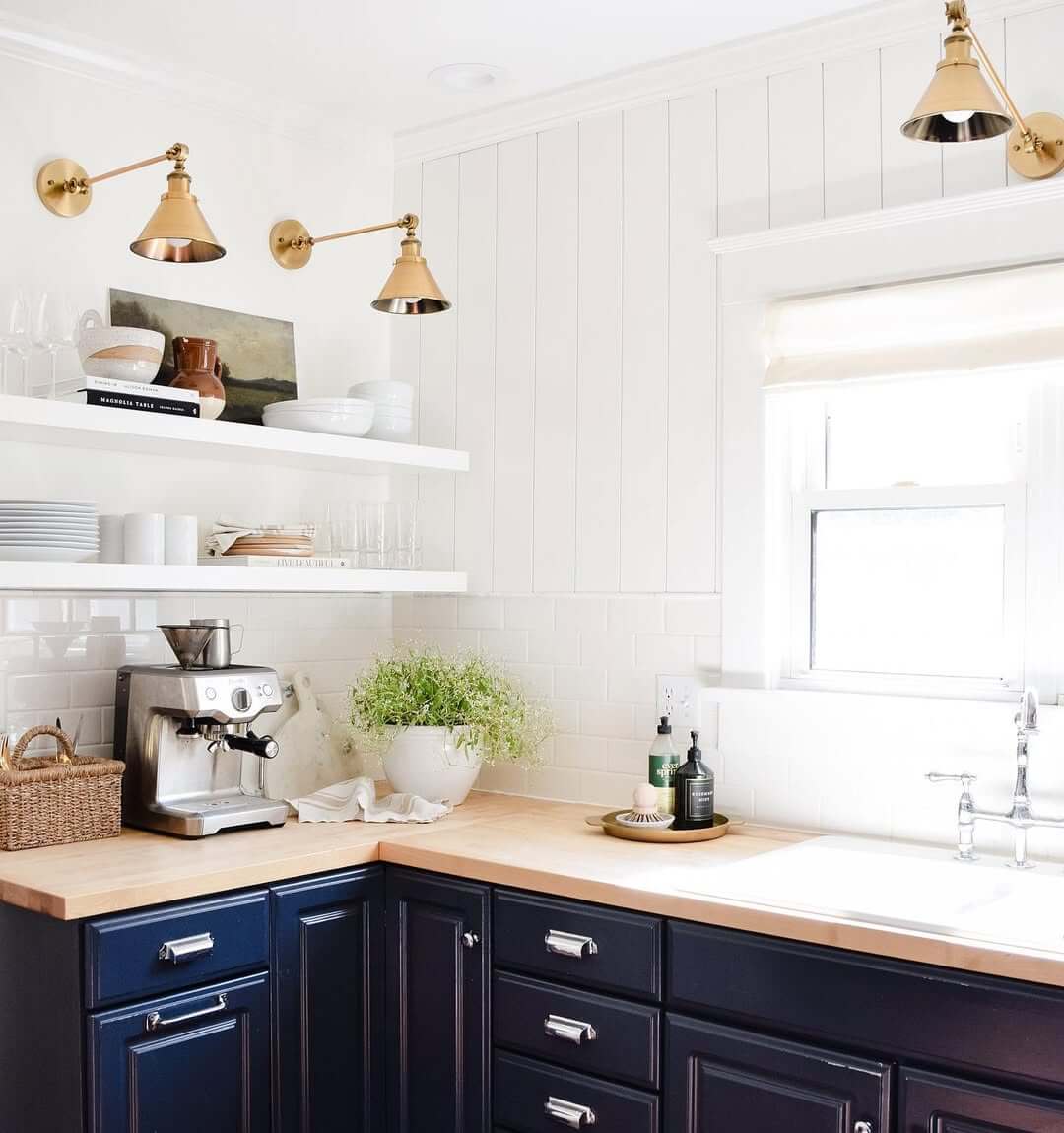 Adjustable Brass Sconces Add Task Lighting Above Open Shelves