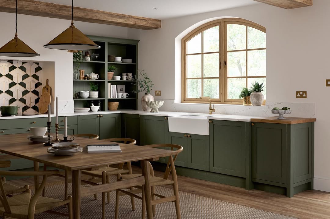 Showcase Ceramics and Books on Deep Green Shelving