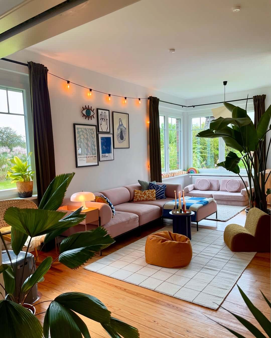 String Lights Add Ambiance Above a Gallery Wall