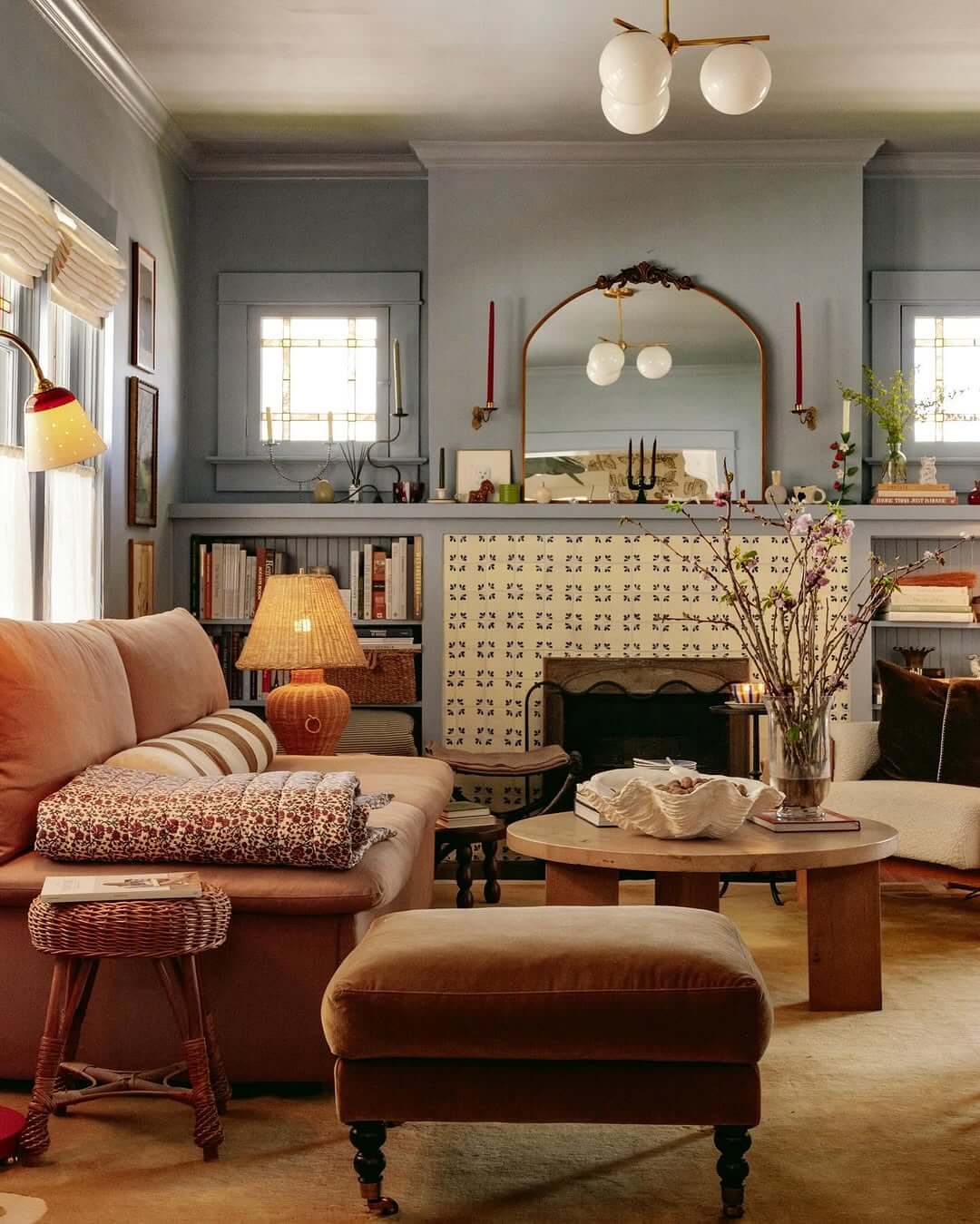 Ornate Mirror Becomes a Textured Focal Point Above the Fireplace