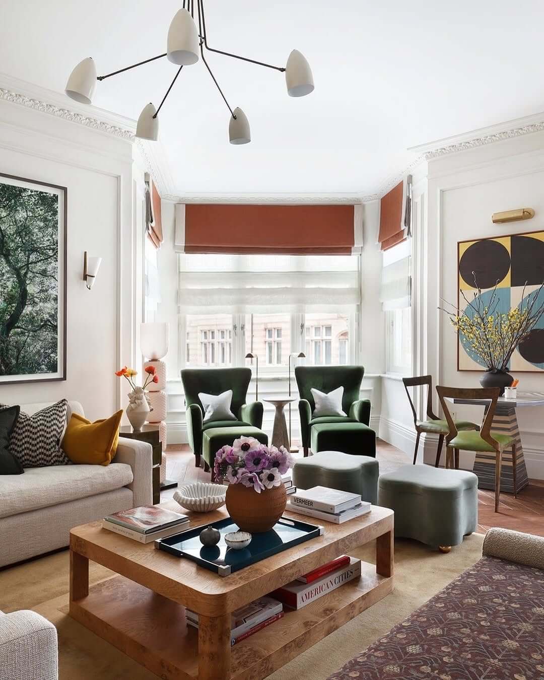 Layered Roman Shades Soften Bay Window Light