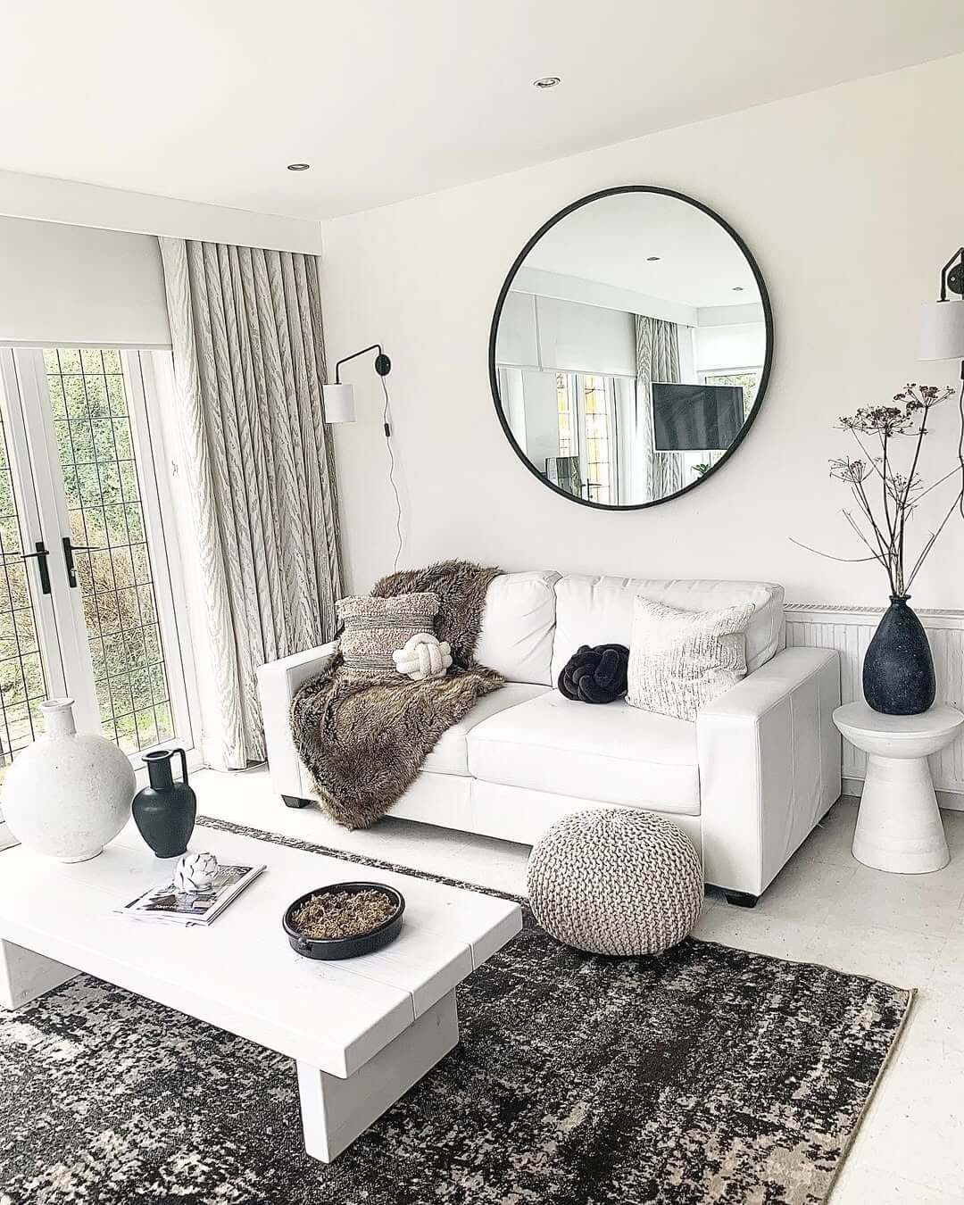 Anchor a Sofa with an Oversized Round Mirror