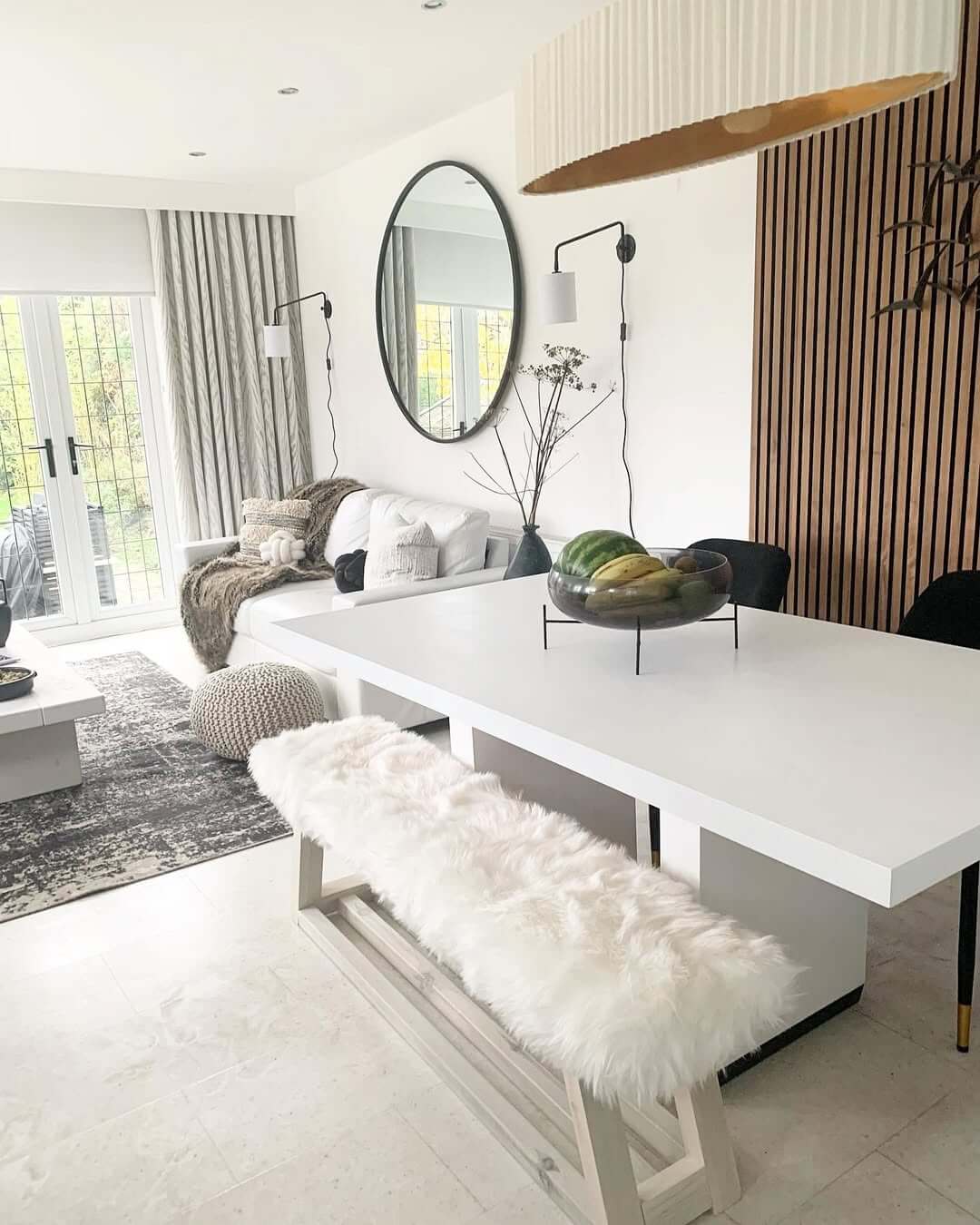 Oval Mirror with Slim Black Frame Adds Subtle Drama