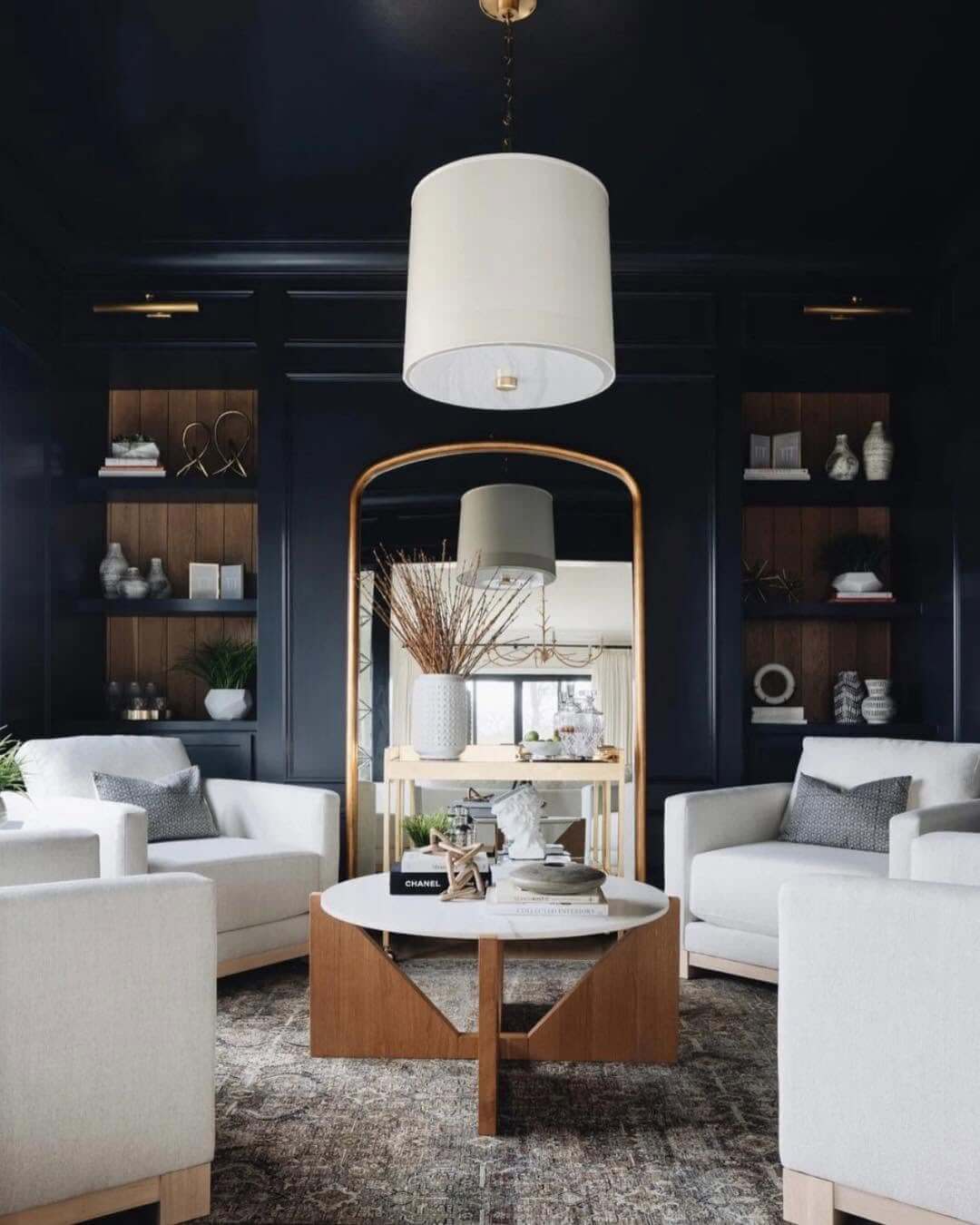 Arched Gold Mirror Reflects a Bar Cart for a Glamorous Touch