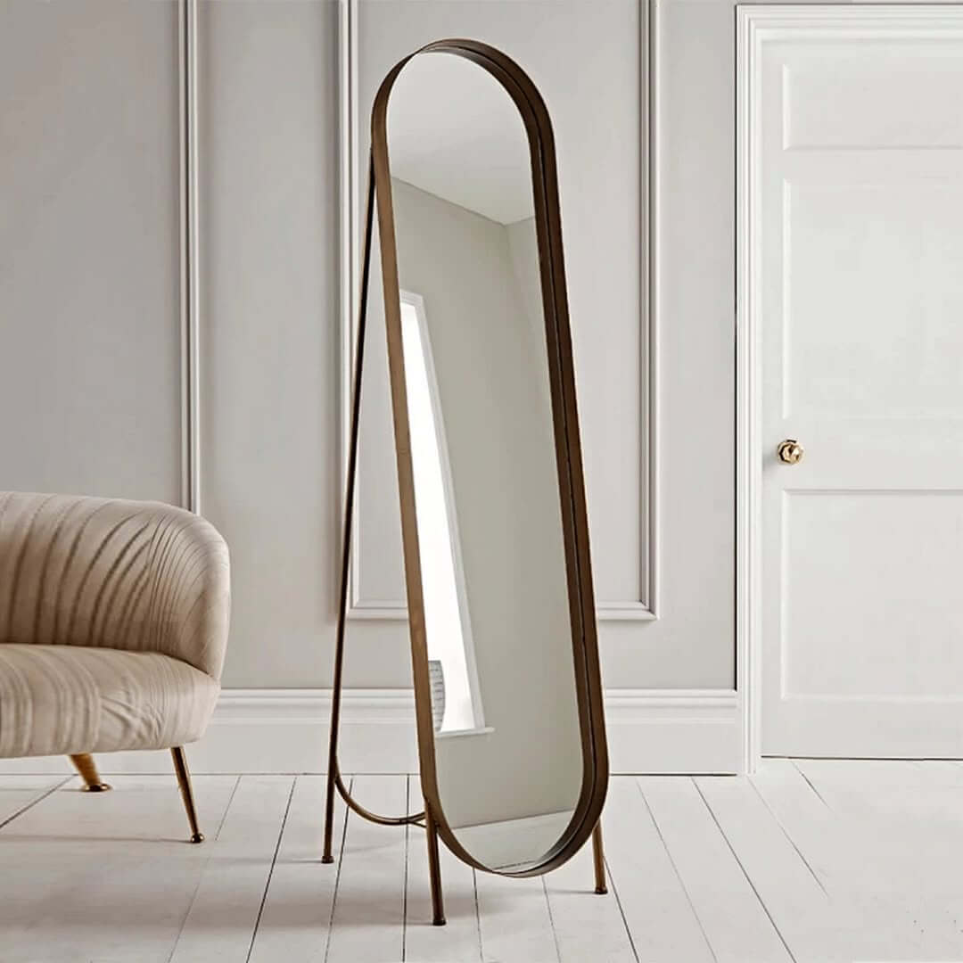 Place a Tall Oval Mirror on Delicate Legs for Lightness