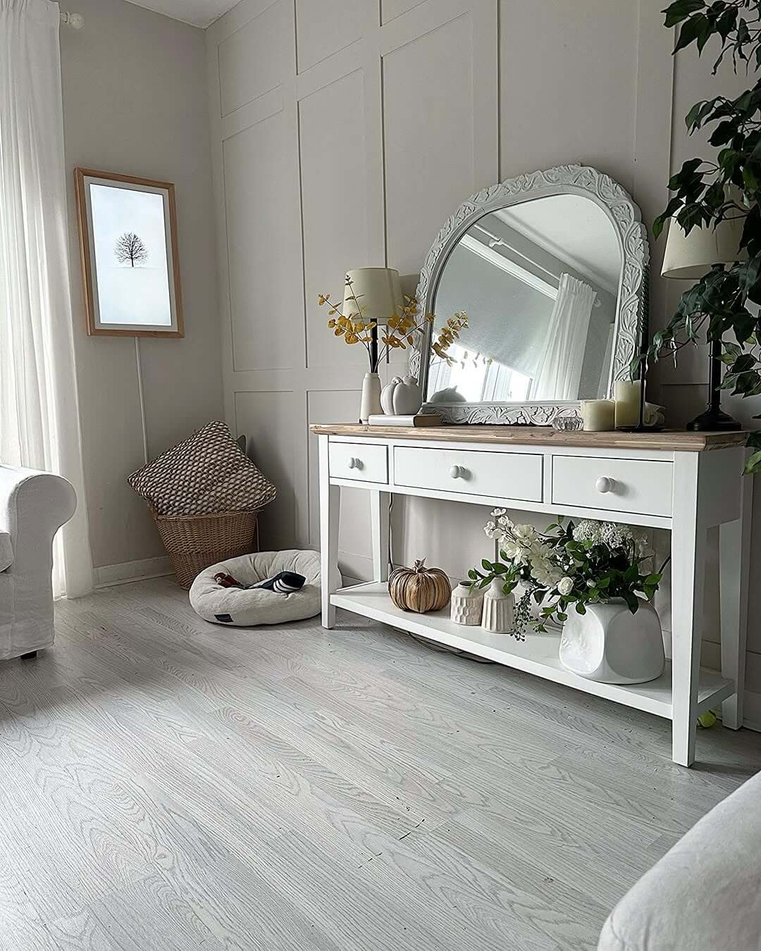 Ornate White Mirror Adds Architectural Detail Above Console