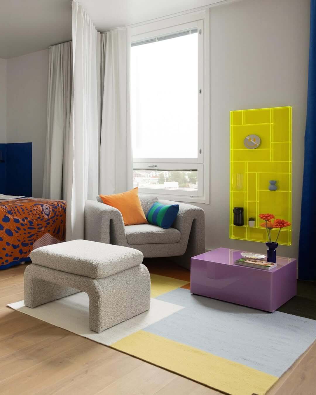 Color Block Rugs Define Playful Zones in a Small Space
