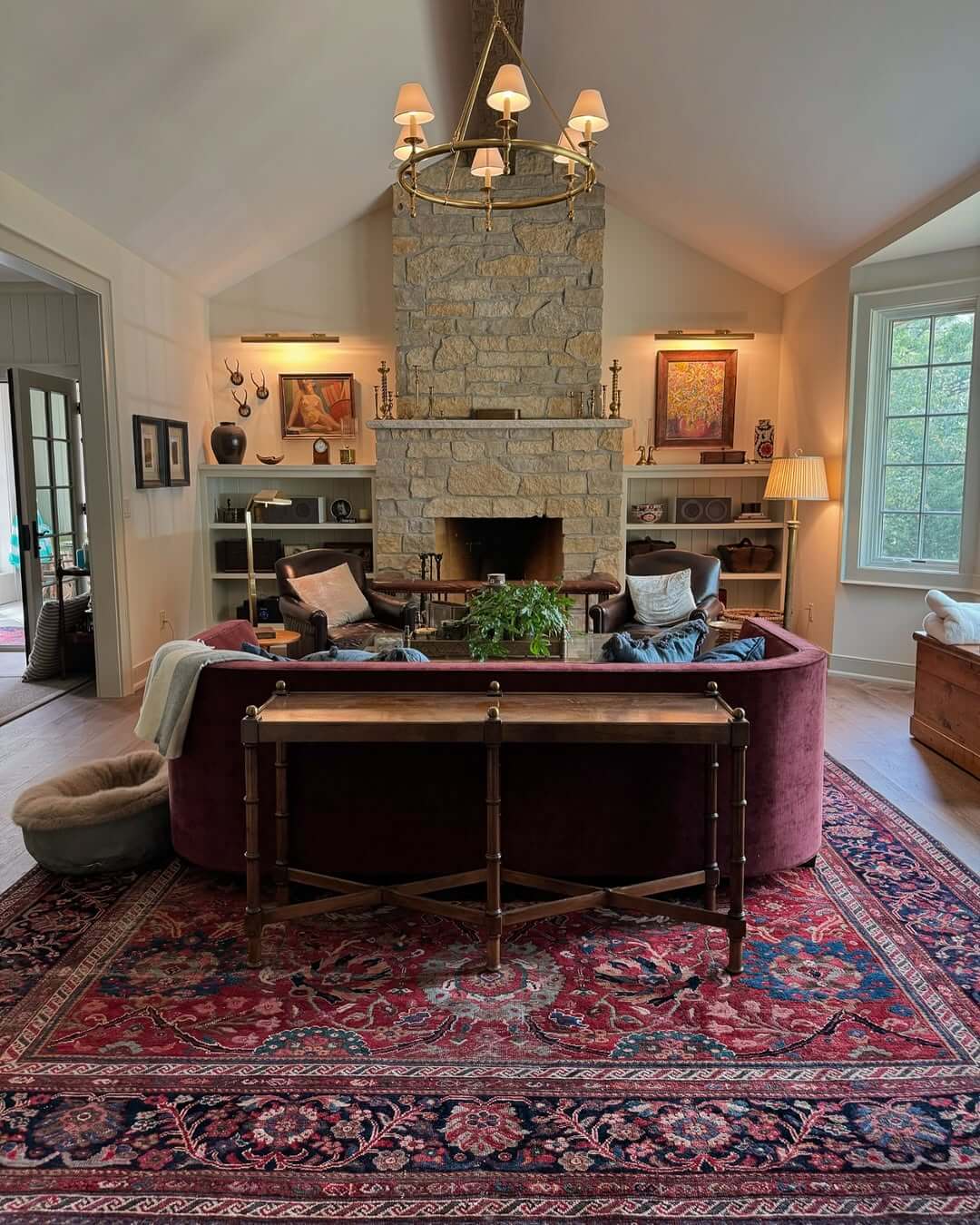 Deep Red Oriental Rugs Define Curved Seating Areas
