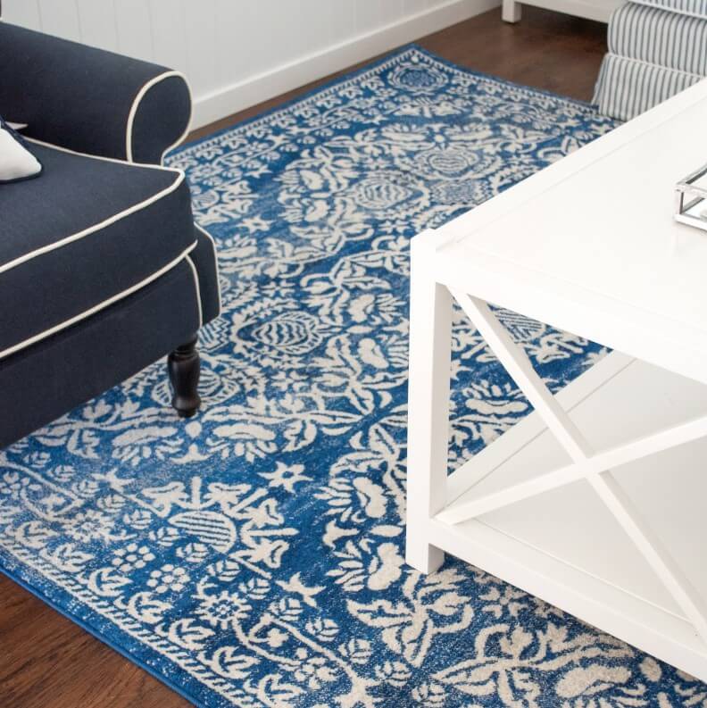 Bold Blue and White Oriental Rugs Anchor Navy Seating