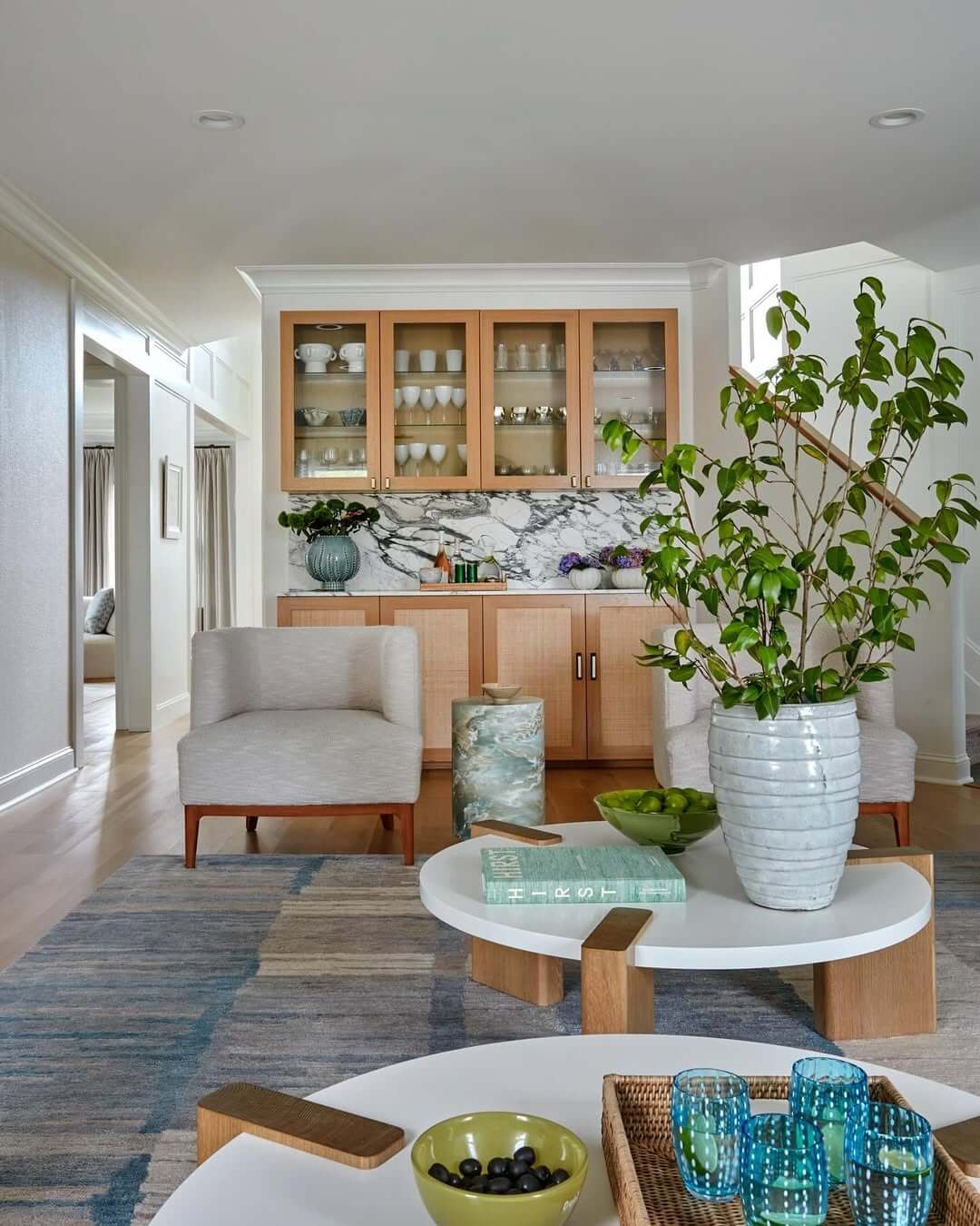 Striped Blue and Beige Rug Grounds Casual Seating Area