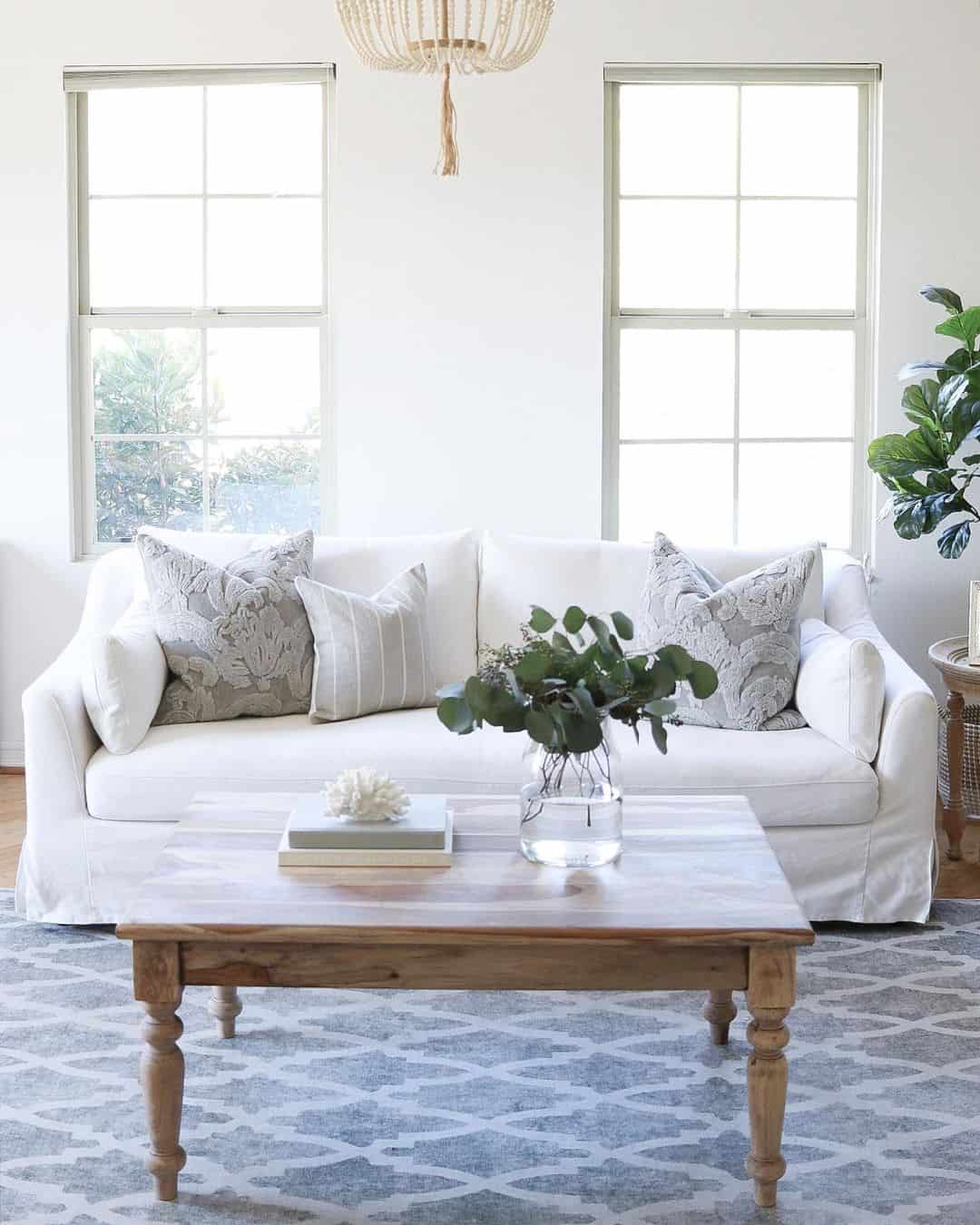 White Slipcovered Sofa Creates A Relaxed Coastal Base