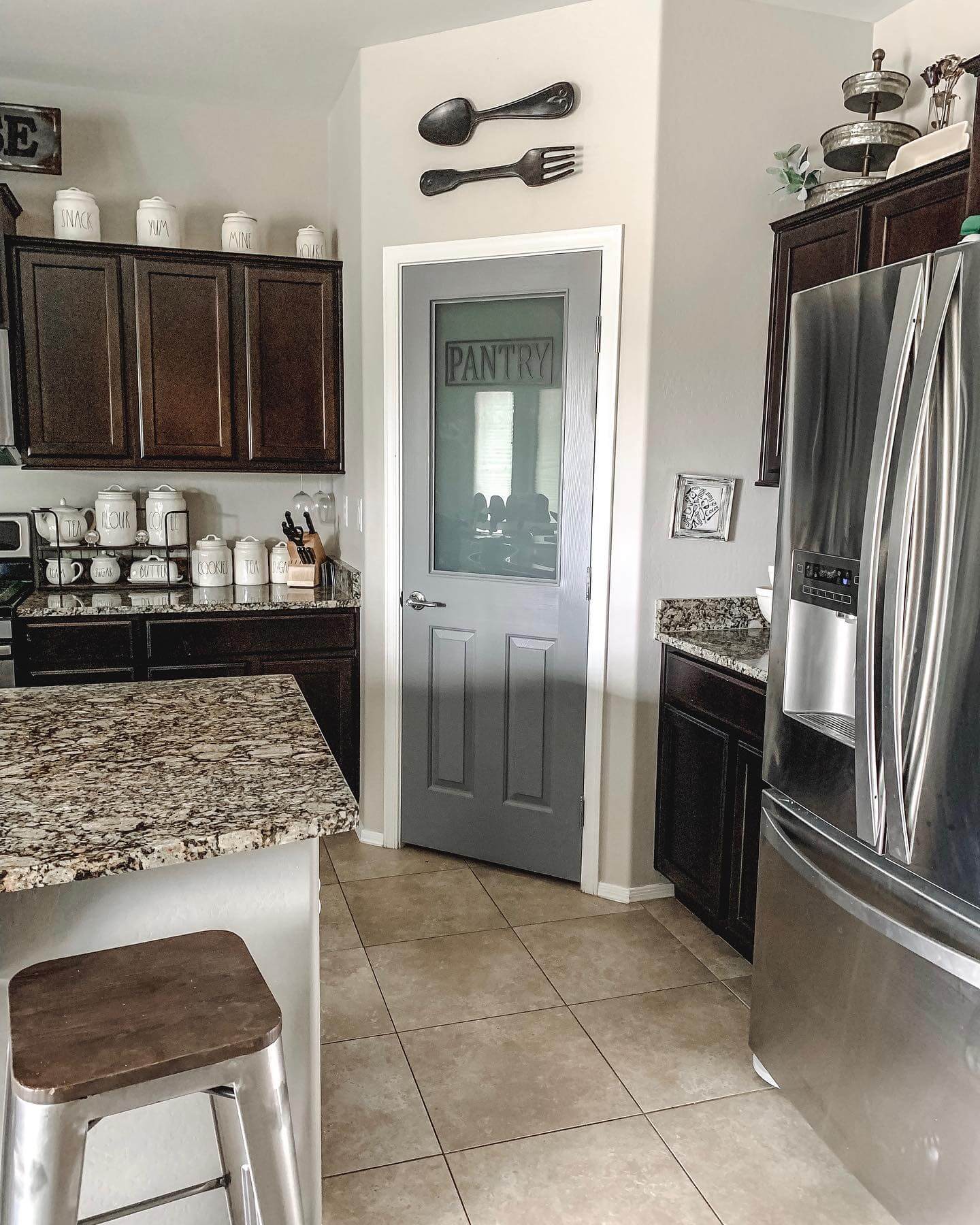 Pantry Door With Frosted Glass Panel and Subtle Gray Paneling
