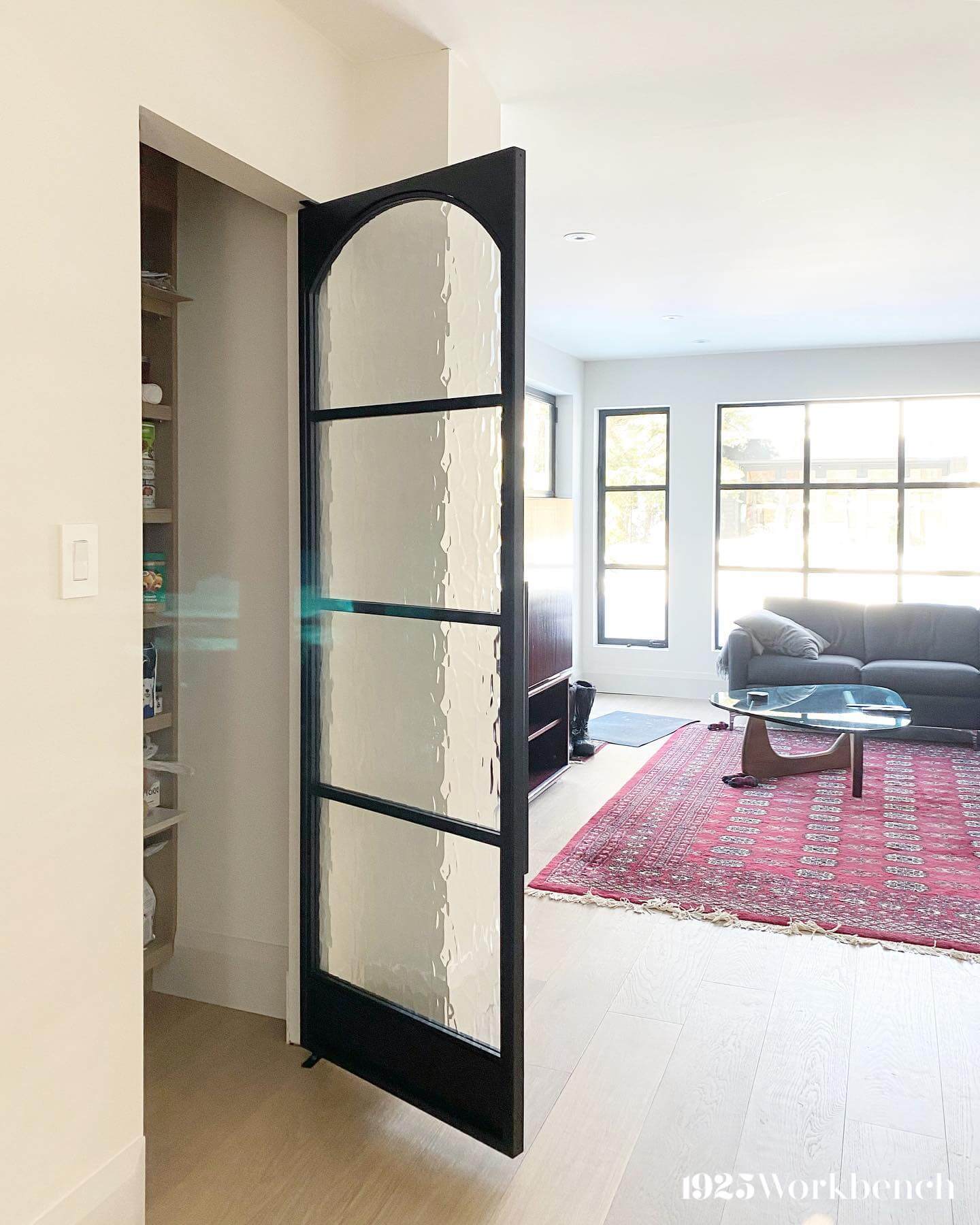 Arched Black Metal Door With Hammered Glass Panels