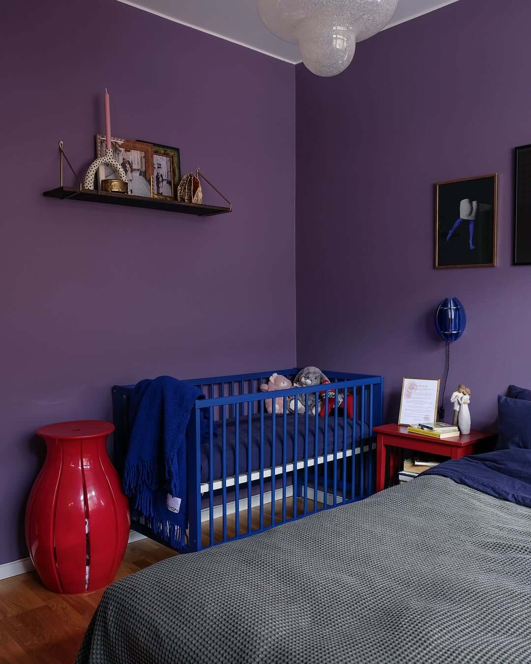 Bold Red Vase Adds a Sculptural Pop to Purple Walls