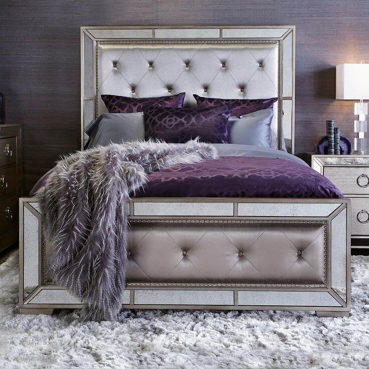 Mirrored Bed Frame Reflects Purple Accents and Light