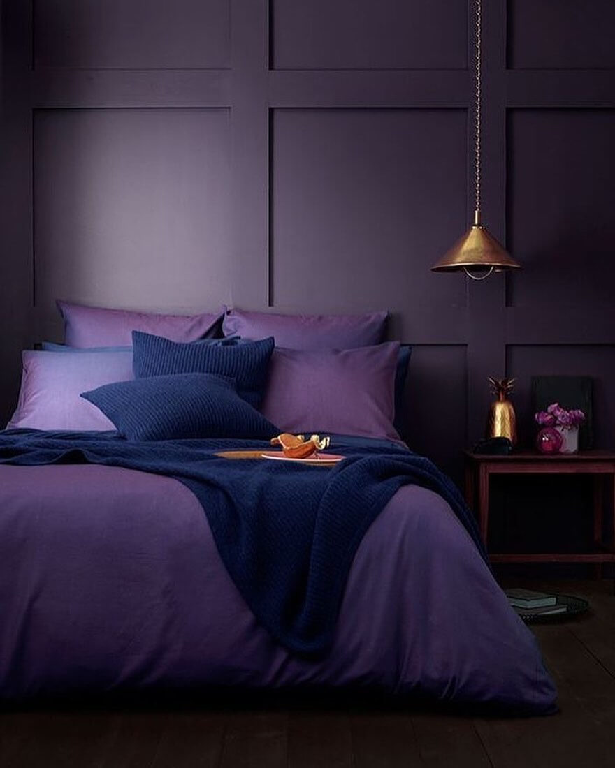 Deep Purple Walls with Geometric Paneling Create a Moody Backdrop