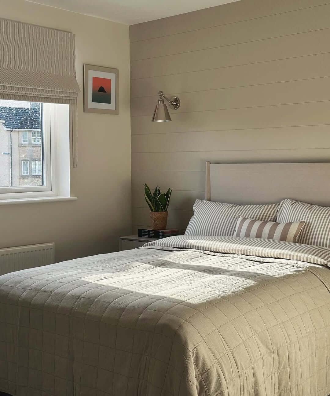 Horizontal Shiplap Wall with a Modern Swing-Arm Sconce