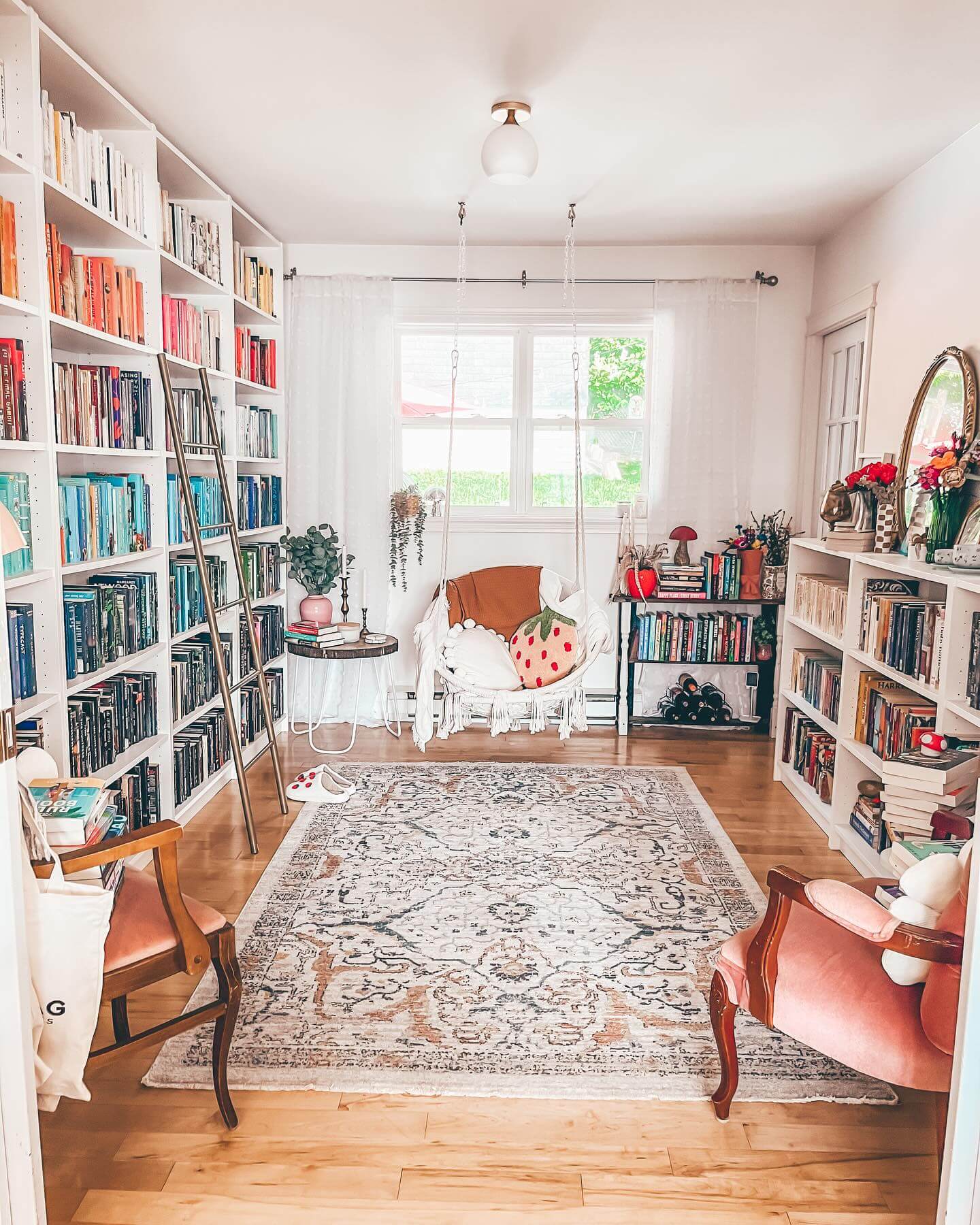 Gold Ladder for Accessing Tall White Bookshelves
