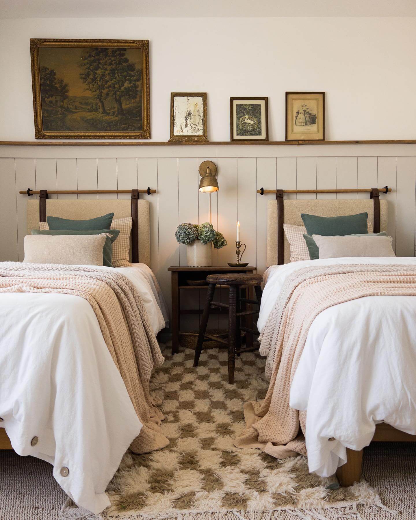 Framed Vintage Art Above Headboards Creates Gallery Wall